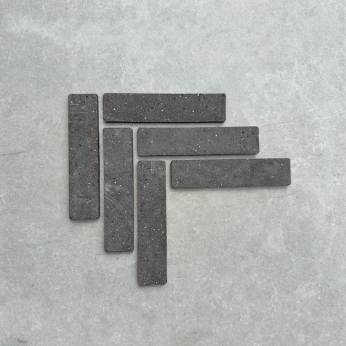 Black clay brick slips wall - slips,